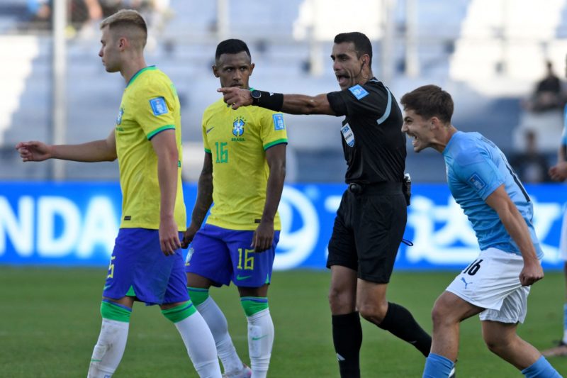 Israel's midfielder Ran Binyamin (L) celebrates as Costa Rica's referee Juan Gabriel Calderon awards a penalty-kick to his team, next to Brazil's midfielder Ronald (L) and Brazil's forward Marquinhos during extra-time of the Argentina 2023 U-20 World Cup quarter-final football match between Israel and Brazil at the San Juan del Bicentenario stadium in San Juan, Argentina, on June 3, 2023. Israel on 3-2.(Photo by ANDRES LARROVERE/AFP via Getty Images)