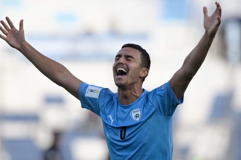 Israel's defender Or Israelov celebrates after defeating Brazil 3-2 in extra-time of the Argentina 2023 U-20 World Cup quarter-final football match between Israel and Brazil and qualifying to the semi-finals at the San Juan del Bicentenario stadium in San Juan, Argentina, on June 3, 2023. (Photo by ANDRES LARROVERE/AFP via Getty Images)
