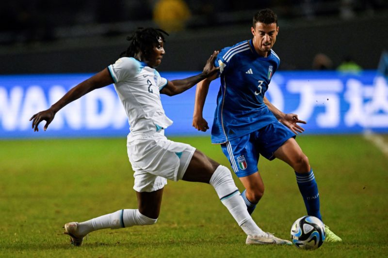 England's defender Brooke Norton-Cuffy (L) and Italy's defender Riccardo Turicchia vie for the ball during the Argentina 2023 U-20 World Cup round of 16 football match between England and Italy at the Diego Armando Maradona stadium in La Plata, Argentina, on May 31, 2023. (Photo by LUIS ROBAYO/AFP via Getty Images)