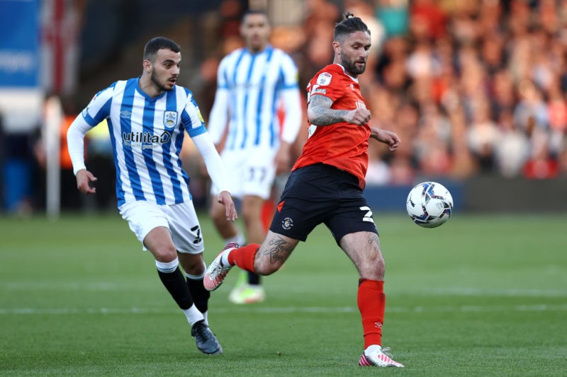 LUTON, ENGLAND - MAY 13: James Bree of Luton Town battles for the ball with Pipa of Huddersfield Town during the Sky Bet Championship Play-off Semi Final 1st Leg match between Luton Town and Huddersfield Town at Kenilworth Road on May 13, 2022 in Luton, England. (Photo by Ryan Pierse/Getty Images)