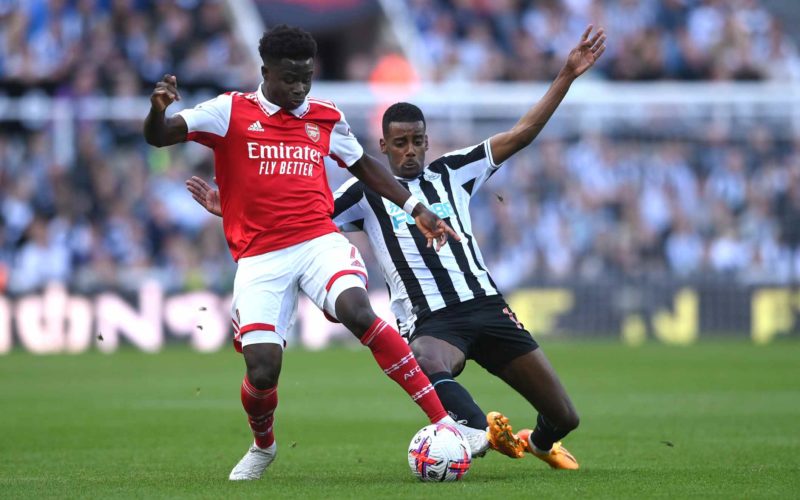 NEWCASTLE UPON TYNE, ENGLAND - MAY 07: Alexander Isak of Newcastle challenges Bukayo Saka of Arsenal during the Premier League match between Newcastle United and Arsenal FC at St. James Park on May 07, 2023 in Newcastle upon Tyne, England. (Photo by Stu Forster/Getty Images)