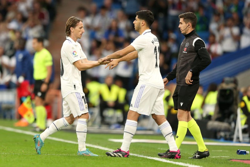 MADRID, SPAIN - MAY 24: Luka Modric of Real Madrid is substituted off for Marco Asensio of Real Madrid during the LaLiga Santander match between Real Madrid CF and Rayo Vallecano at Estadio Santiago Bernabeu on May 24, 2023 in Madrid, Spain. (Photo by Florencia Tan Jun/Getty Images)