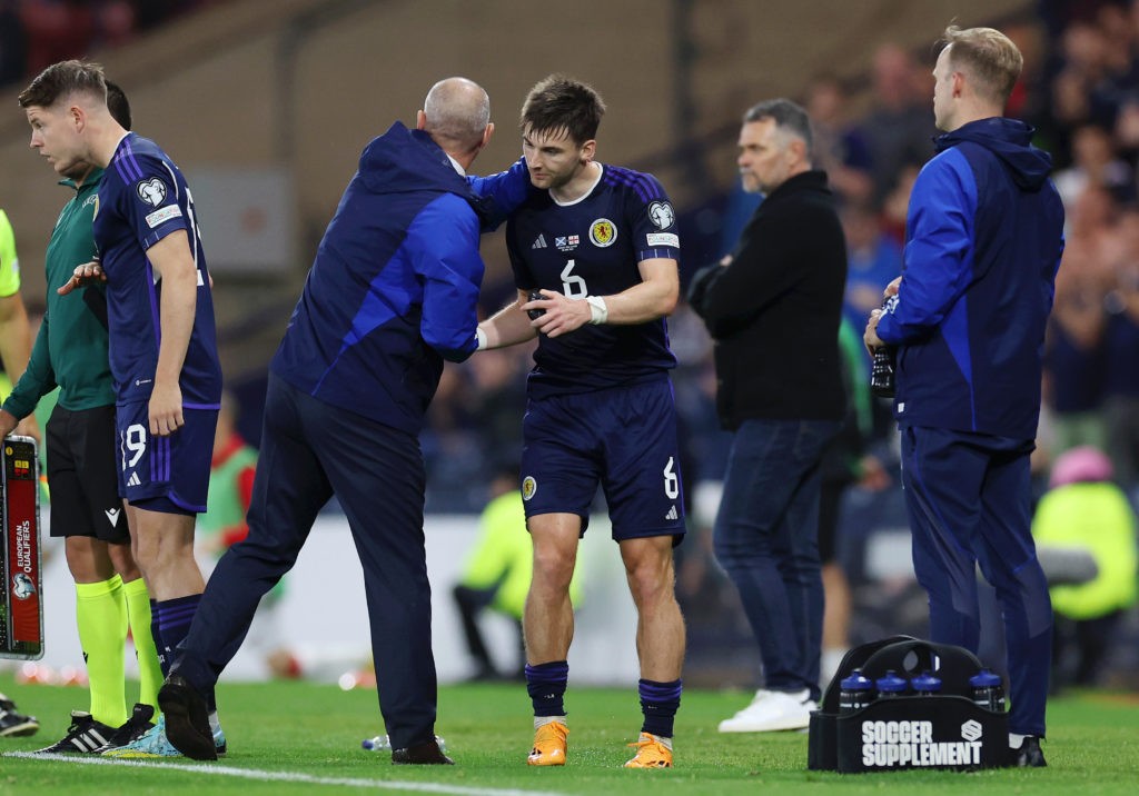 GLASGOW, SCOTLAND - JUNE 20: Kieran Tierney of Scotland shakes hands with Steve Clarke, Head Coach of Scotland, after being substitutted off the UEFA EURO 2024 qualifying round group A match between Scotland and Georgia at Hampden Park on June 20, 2023 in Glasgow, Scotland. (Photo by Ian MacNicol/Getty Images)
