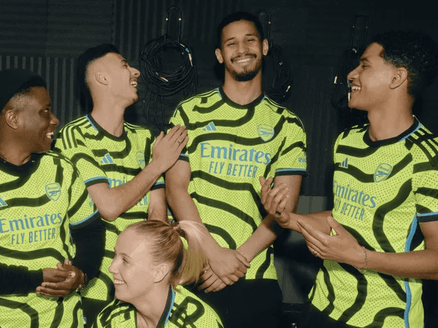 Arsenal players and artists in the new Arsenal away kit for 2023/24 (Photo via Arsenal.com)