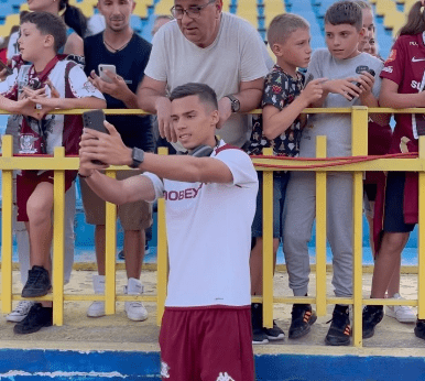 Catalin Cirjan takes photos with FC Rapid fans (Photo via Rapid on Instagram)