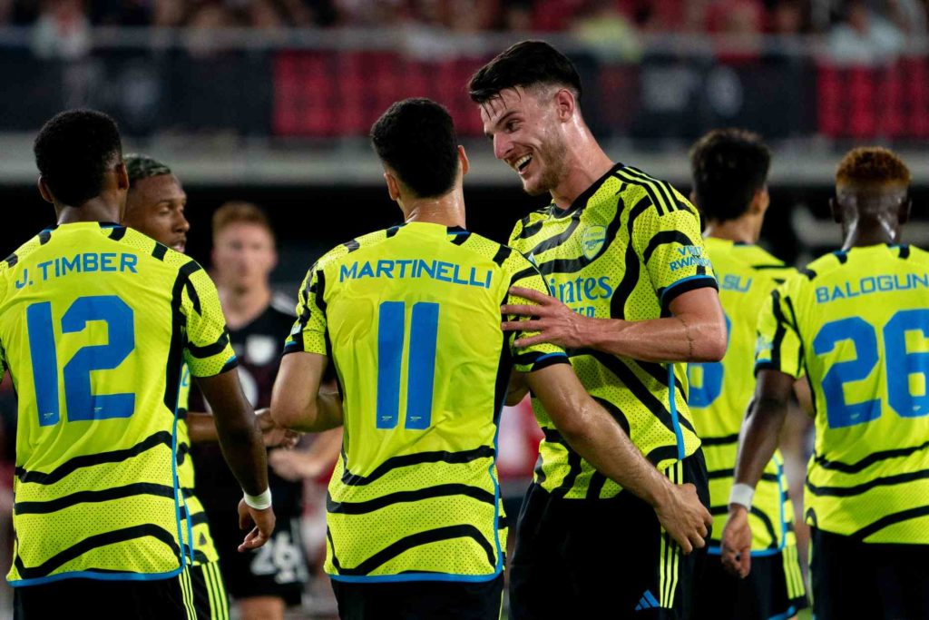 Arsenal's Declan Rice celebrates with teammate Gabriel Martinelli after Martinelli scored a goal during a friendly football match between the Major League Soccer (MLS) All-Star team and Arsenal FC, at Audi Field in Washington, DC, on July 19, 2023. (Photo by STEFANI REYNOLDS/AFP via Getty Images)