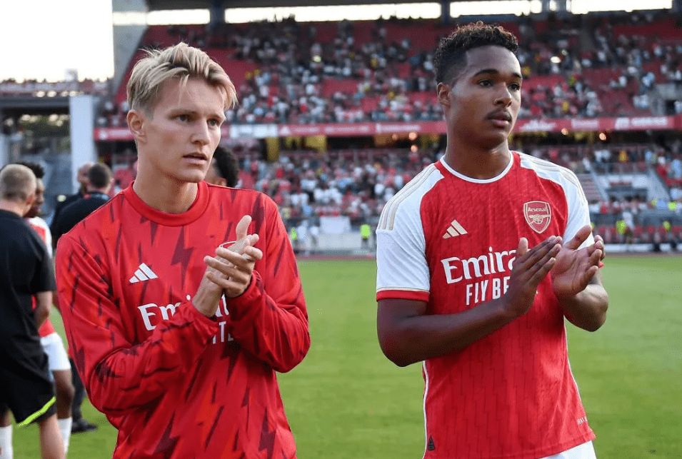 Martin Odegaard and Reuell Walters applaud the Arsenal fans (Photo via Arsenal.com)