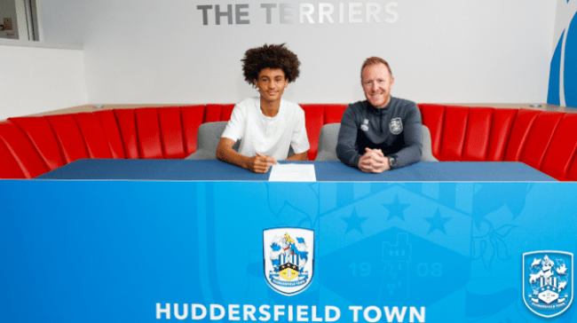 Anthony Gregory signs for Huddersfield Town (image via Huddersfield Town)