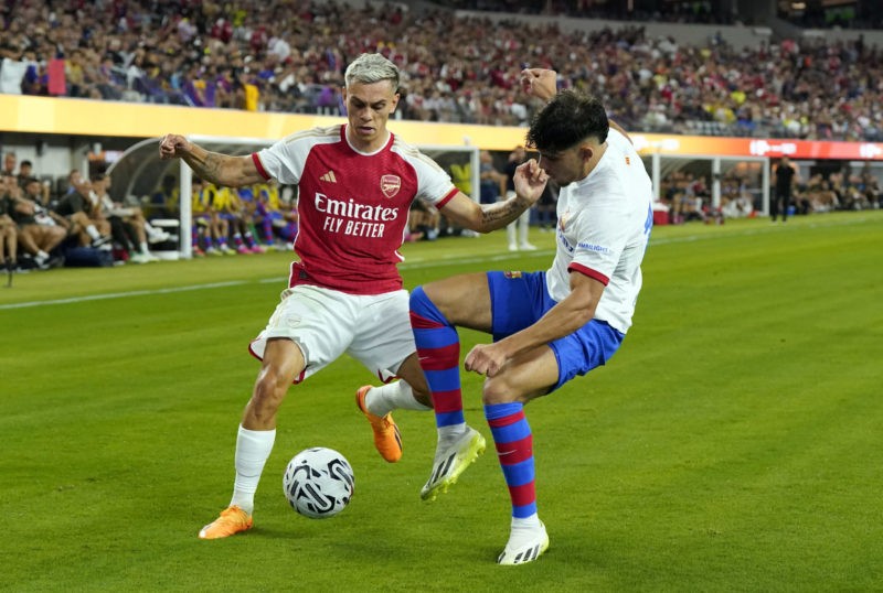 INGLEWOOD, CALIFORNIA - JULY 26: Leandro Trossard #19 of Arsenal controls the ball against Abde Ezzalzouli #16 of Barcelona  during the first half of a pre-season friendly match at SoFi Stadium on July 26, 2023 in Inglewood, California. (Photo by Kevork Djansezian/Getty Images)