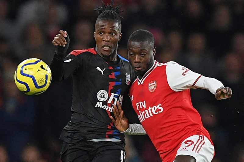 Crystal Palace's Ivorian striker Wilfried Zaha (L) vies with Arsenal's French-born Ivorian midfielder Nicolas Pepe (R) during the English Premier League football match between Arsenal and Crystal Palace at the Emirates Stadium in London on October 27, 2019. - (Photo by DANIEL LEAL/AFP via Getty Images)