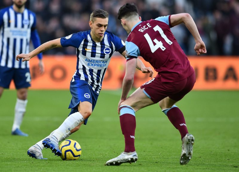 Brighton's Belgian midfielder Leandro Trossard (L) vies with West Ham United's English midfielder Declan Rice  during the English Premier League football match between West Ham United and Brighton and Hove Albion at The London Stadium, in east London on February 1, 2020. (Photo by Glyn KIRK / AFP)