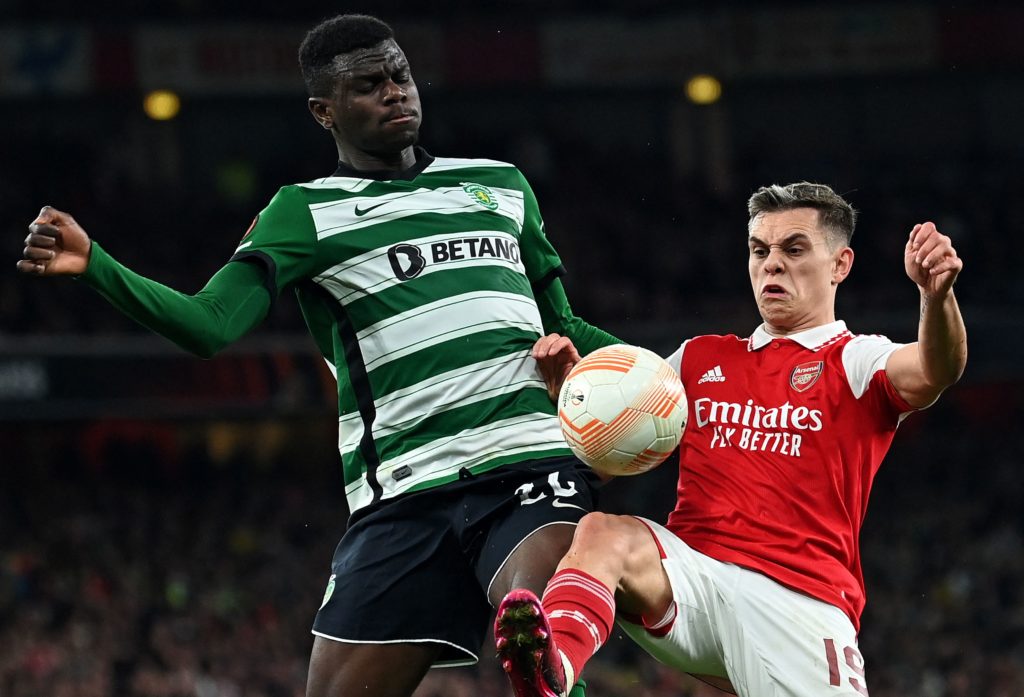 Sporting Lisbon's Ivory Coast defender Ousmane Diomande (L) vies with Arsenal's Belgian midfielder Leandro Trossard during the UEFA Europa League round of 16, second-leg football match between Arsenal and Sporting Lisbon at the Emirates Stadium in London on March 16, 2023. (Photo by GLYN KIRK/AFP via Getty Images)