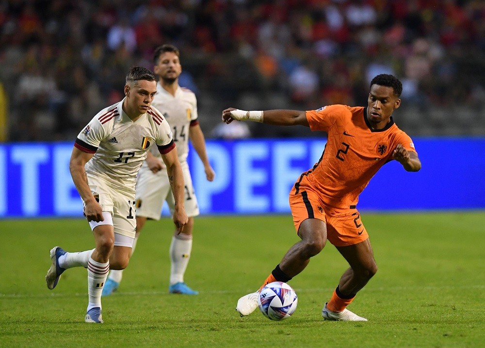 Belgium's Leandro Trossard (L) fights for the ball with Netherlands' Jurrien Timber (R) during the UEFA Nations League football match between Belgium and Netherlands at the King Baudouin Stadium in Brussels, on June 3, 2022. (Photo by JOHN THYS/AFP via Getty Images)