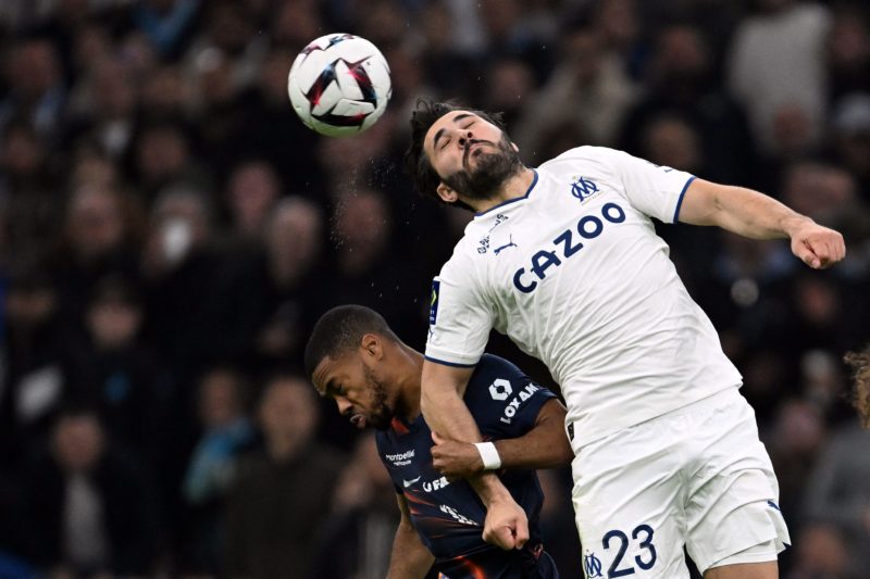 Montpellier's French midfielder Arnaud Nordin (L) fights for the ball with Marseille's Bosnian defender Sead Kolasinac during the French L1 football match between Marseille (OM) and Montpellier at the Velodrome stadium in Marseille, on March 31, 2023. (Photo by NICOLAS TUCAT/AFP via Getty Images)