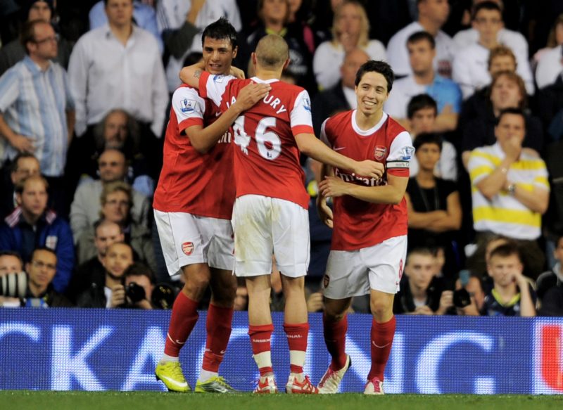 LONDON, ENGLAND - SEPTEMBER 21: Samir Nasri (R) of Arsenal celebrates with teammates Marouane Chamakh (L) and Henri Lansbury (C) after scoring his team's third goal from the penalty spot during the Carling Cup third round match between Tottenham Hotspur and Arsenal at White Hart Lane on September 21, 2010 in London, England. (Photo by Michael Regan/Getty Images)