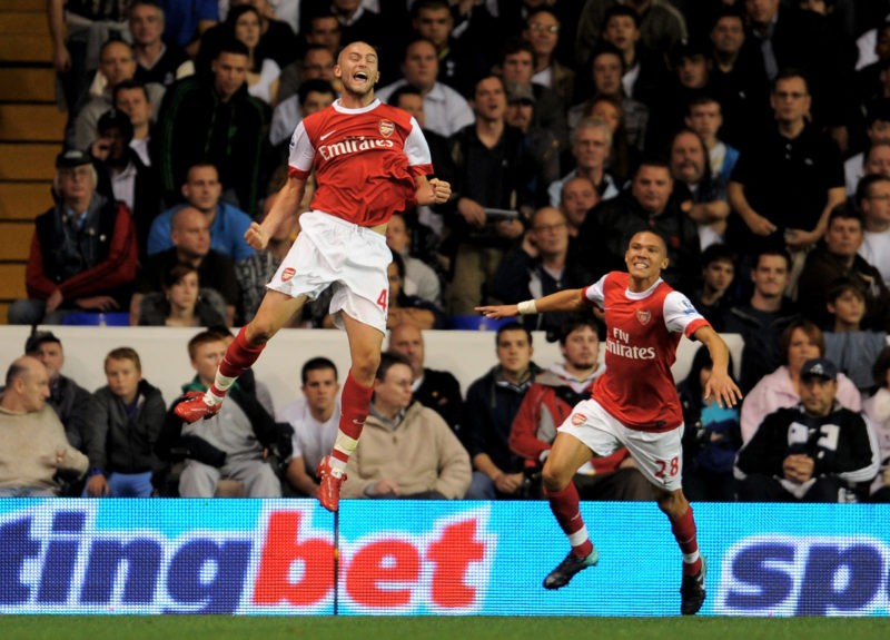 LONDON, ENGLAND - SEPTEMBER 21: Henri Lansbury (L) of Arsenal celebrates after scoring the opening goal during the Carling Cup third round match between Tottenham Hotspur and Arsenal at White Hart Lane on September 21, 2010 in London, England. (Photo by Michael Regan/Getty Images)