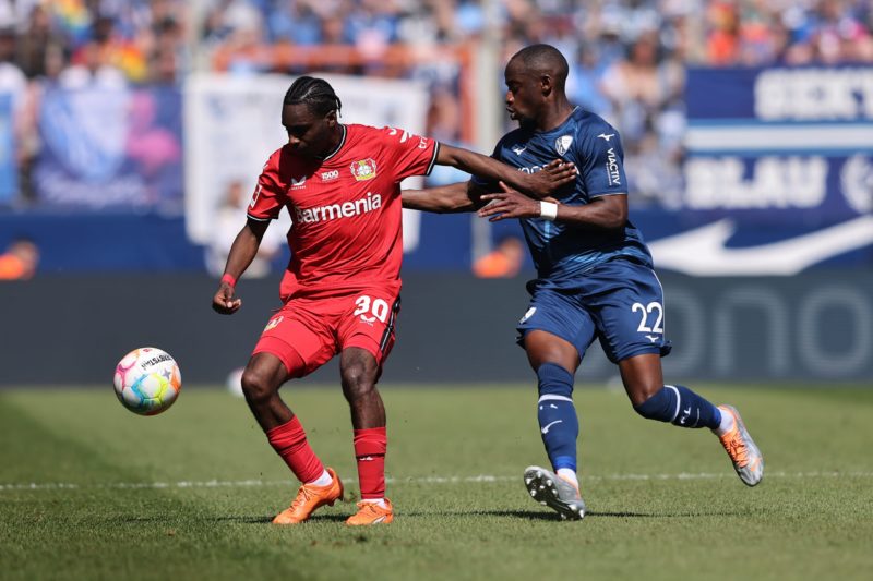 BOCHUM, GERMANY - MAY 27: Jeremie Frimpong of Bayer 04 Leverkusen holds off Christopher Antwi-Adjej of VfL Bochum 1848 during the Bundesliga match between VfL Bochum 1848 and Bayer 04 Leverkusen at Vonovia Ruhrstadion on May 27, 2023 in Bochum, Germany. (Photo by Christof Koepsel/Getty Images)