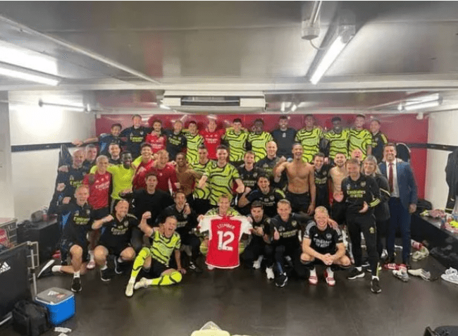 The squad held up Timber's shirt in the dressing room ( Image: jurrientimber/Instagram)