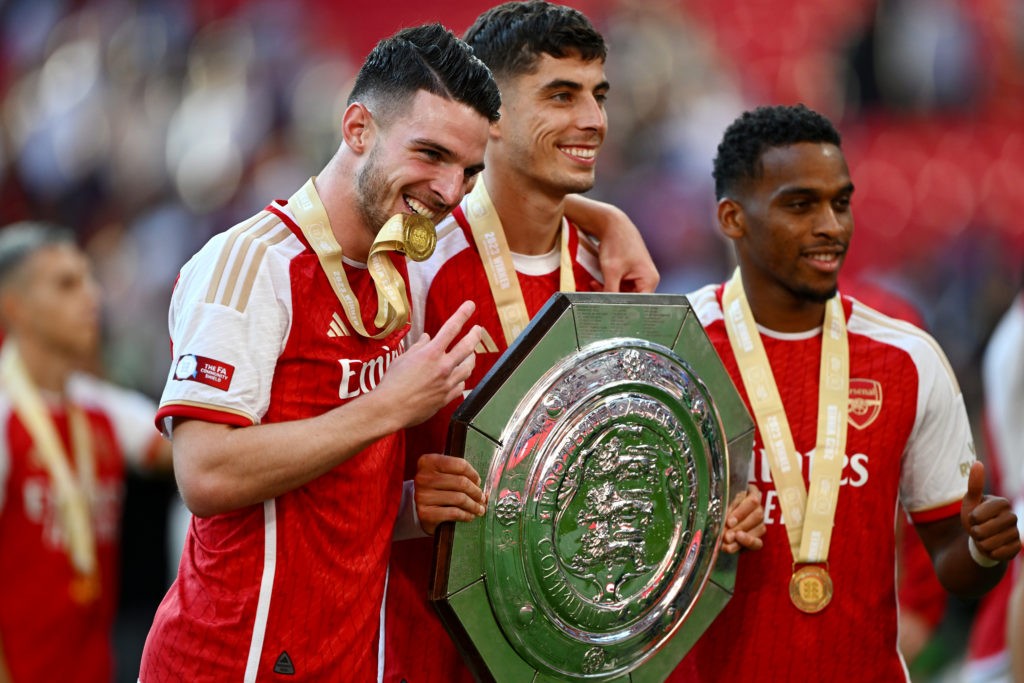 LONDON, ENGLAND - AUGUST 06: Declan Rice, Kai Havertz and Jurrien Timber of Arsenal pose for a photo with the FA Community Shield following The FA Community Shield match between Manchester City against Arsenal at Wembley Stadium on August 06, 2023 in London, England. (Photo by Mike Hewitt/Getty Images)