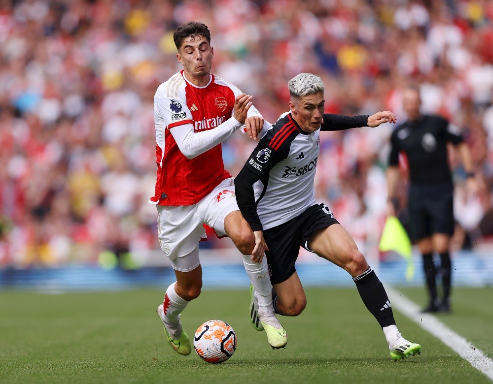 LONDON, ENGLAND: Harry Wilson of Fulham battles for possession with Kai Havertz of Arsenal during the Premier League match between Arsenal FC and Fulham FC at Emirates Stadium on August 26, 2023. (Photo by Paul Harding/Getty Images)