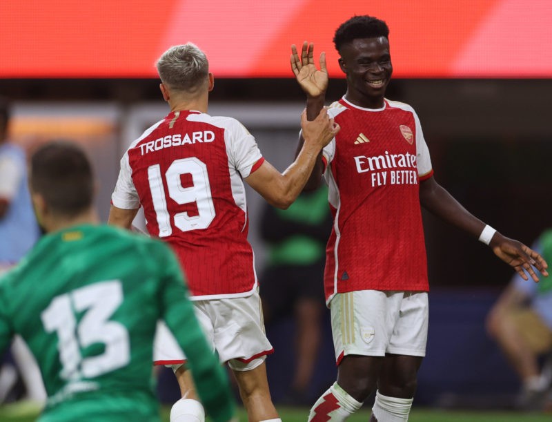 INGLEWOOD, CALIFORNIA - JULY 26: Leandro Trossard #19 of Arsenal celebrates his goal with Bukayo Saka #7 in front of Iñaki Peña (13) of FC Barcelona, for a 4-2 lead over FC Barcelona in a 5-3 Arsenal win, during a pre-season friendly between Arsenal and FC Barcelona at SoFi Stadium on July 26, 2023 in Inglewood, California. (Photo by Harry How/Getty Images)