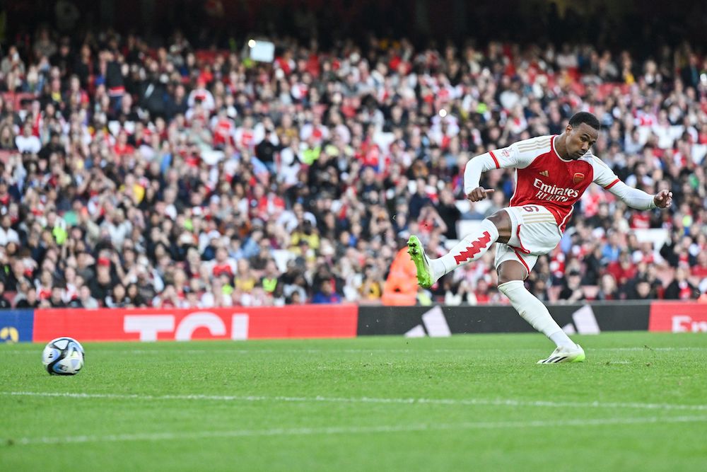 Arsenal's Brazilian defender Gabriel Magalhaes scores the winning penalty during the pre-season friendly football match for the Emirates Cup final between Arsenal and Monaco at The Emirates Stadium in north London on August 2, 2023. (Photo by GLYN KIRK/AFP via Getty Images)