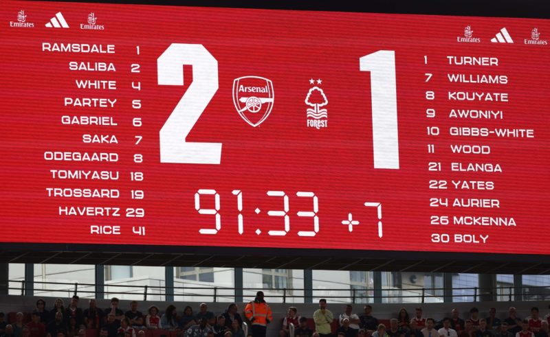 An electronic screen displays the 7 minutes of extra time in the second half of the English Premier League football match between Arsenal and Nottingham Forest at the Emirates Stadium in London on August 12, 2023. (Photo by HENRY NICHOLLS/AFP via Getty Images)