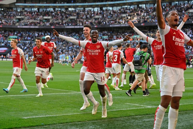 Arsenal's English striker Eddie Nketiah (C) and teammates celebrate after Arsenal win the penalty shoot-out after the English FA Community Shield football match between Arsenal and Manchester City at Wembley Stadium, in London, August 6, 2023. Arsenal won after a 4-1 penalty shoot-out win, following the 1-1 draw in 90 minutes. (Photo by JUSTIN TALLIS/AFP via Getty Images)