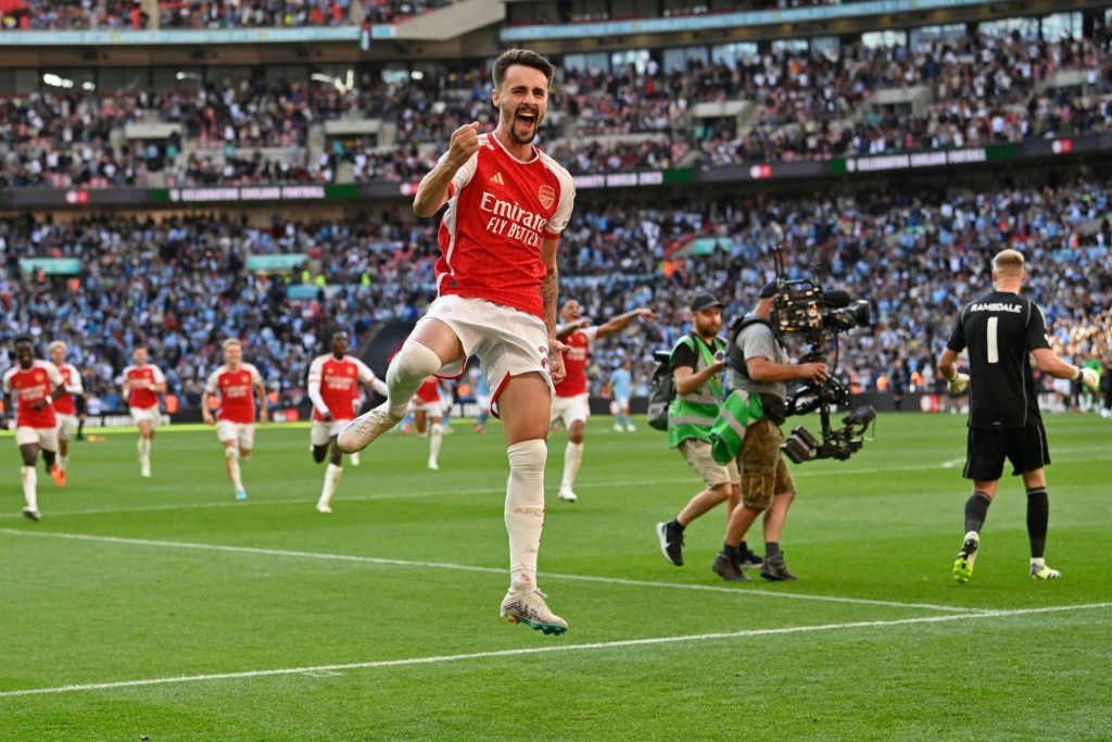 Arsenal's Portuguese midfielder Fabio Vieira celebrates after scoring the final penalty in the shoot-out after the English FA Community Shield football match between Arsenal and Manchester City at Wembley Stadium, in London, August 6, 2023. Arsenal won after a 4-1 penalty shoot-out win, following the 1-1 draw in 90 minutes. (Photo by JUSTIN TALLIS/AFP via Getty Images)