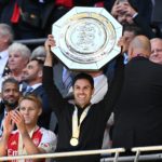 Arsenal's Spanish manager Mikel Arteta lifts the trophy after Arsenal win the shoot-out after the English FA Community Shield football match between Arsenal and Manchester City at Wembley Stadium, in London, August 6, 2023. Arsenal won after a 4-1 penalty shoot-out win, following the 1-1 draw in 90 minutes. (Photo by GLYN KIRK/AFP via Getty Images)