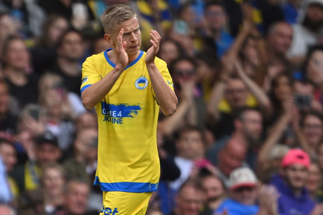 Team Yellow's captain, Ukrainian midfielder Oleksandr Zinchenko applauds the fans as he leaves the pitch after being substituted off during the Game4Ukraine fundraising football match between Oleksandr Zinchenko's team and Andriy Shevchenko's team at Stamford Bridge in London, on August 5, 2023. (Photo by JUSTIN TALLIS/AFP via Getty Images)