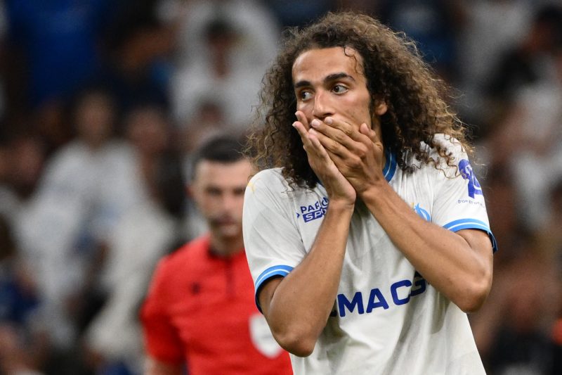 Marseille's French midfielder #06 Matteo Guendouzi reacts after missing his penalty during the penalty shootout of the UEFA Champions League second leg of the third qualifying round football match between Olympique Marseille (OM) and Panathinaikos at the Velodrome stadium in Marseille, on August 15, 2023. (Photo by CHRISTOPHE SIMON/AFP via Getty Images)