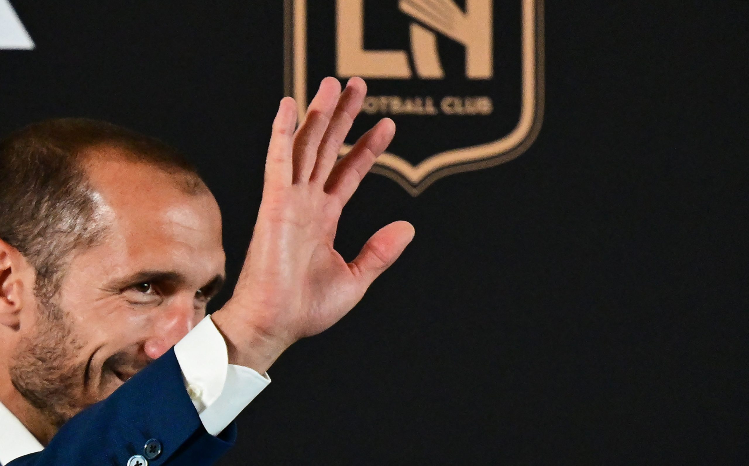 Giorgio Chiellini waves as he arrives for a press conference introducing his arrival to Major League Soccer club Los Angeles FC (LAFC) on June 29, 2022 in Los Angeles. - The former Juventus defender joins LAFC on July 1.  (Photo by FREDERIC J. BROWN/AFP via Getty Images)