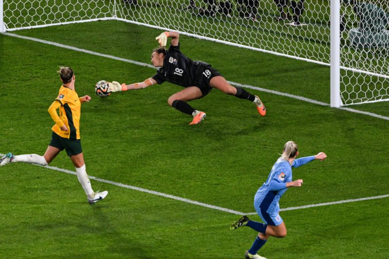 TOPSHOT - England's forward #23 Alessia Russo (R) scores a goal past Australia's goalkeeper #18 Mackenzie Arnold during the Australia and New Zealand 2023 Women's World Cup semi-final football match between Australia and England at Stadium Australia in Sydney on August 16, 2023. (Photo by SAEED KHAN/AFP via Getty Images)