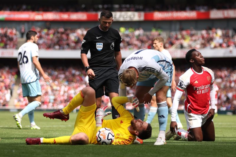LONDON, ENGLAND - AUGUST 12: Matt Turner of Nottingham Forest reacts following a collision with Eddie Nketiah of Arsenal during the Premier League match between Arsenal FC and Nottingham Forest at Emirates Stadium on August 12, 2023 in London, England. (Photo by Julian Finney/Getty Images)