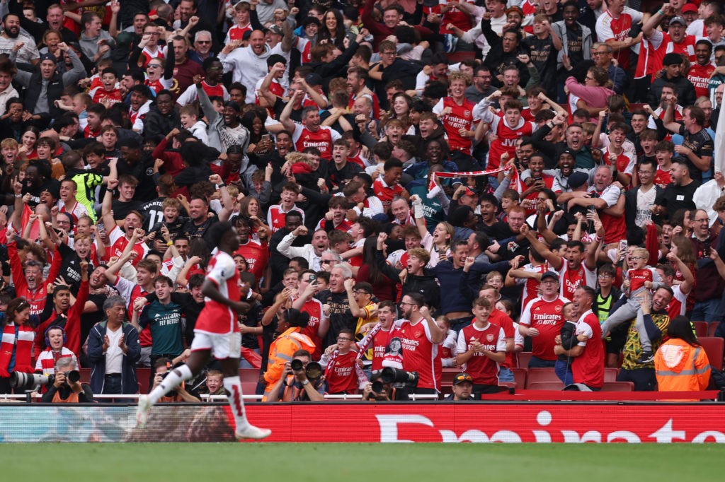 LONDON, ENGLAND - SEPTEMBER 24: Arsenal fans celebrate their sides first goal during the Premier League match between Arsenal FC and Tottenham Hotspur at Emirates Stadium on September 24, 2023 in London, England. (Photo by Alex Pantling/Getty Images)