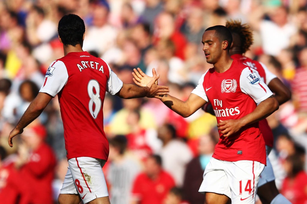 LONDON, ENGLAND: Mikel Arteta of Arsenal (L) congratulates Theo Walcott of Arsenal for scoring Arsenal's second goal of the match during the Barclays Premier League match between Arsenal and Aston Villa at Emirates Stadium on March 24, 2012. (Photo by Julian Finney/Getty Images)