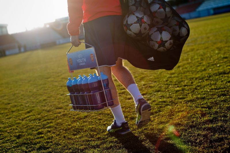 MAJADAHONDA, SPAIN - JANUARY 27: A member of the Arsenal staff enters with the balls and isotonic drinks for the warming up prior to start the UEFA Youth League match between Atletico de Madrid and Arsenal at Atletico de Madrid Sport City on January 27, 2015 in Majadahonda, Spain. (Photo by Gonzalo Arroyo Moreno/Getty Images)