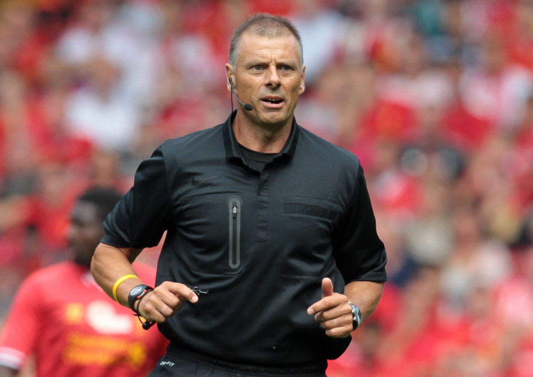 Referee Mark Halsey seen during the pre-season friendly football match between Liverpool and Olympiakos at Anfield Stadium in Liverpool, northwest England on August 3, 2013. The game is a testimonial match for Liverpool captain Steven Gerrard who recently signed a new two-year contract extension with Liverpool, the only club he has ever played for. AFP PHOTO/LINDSEY PARNABY