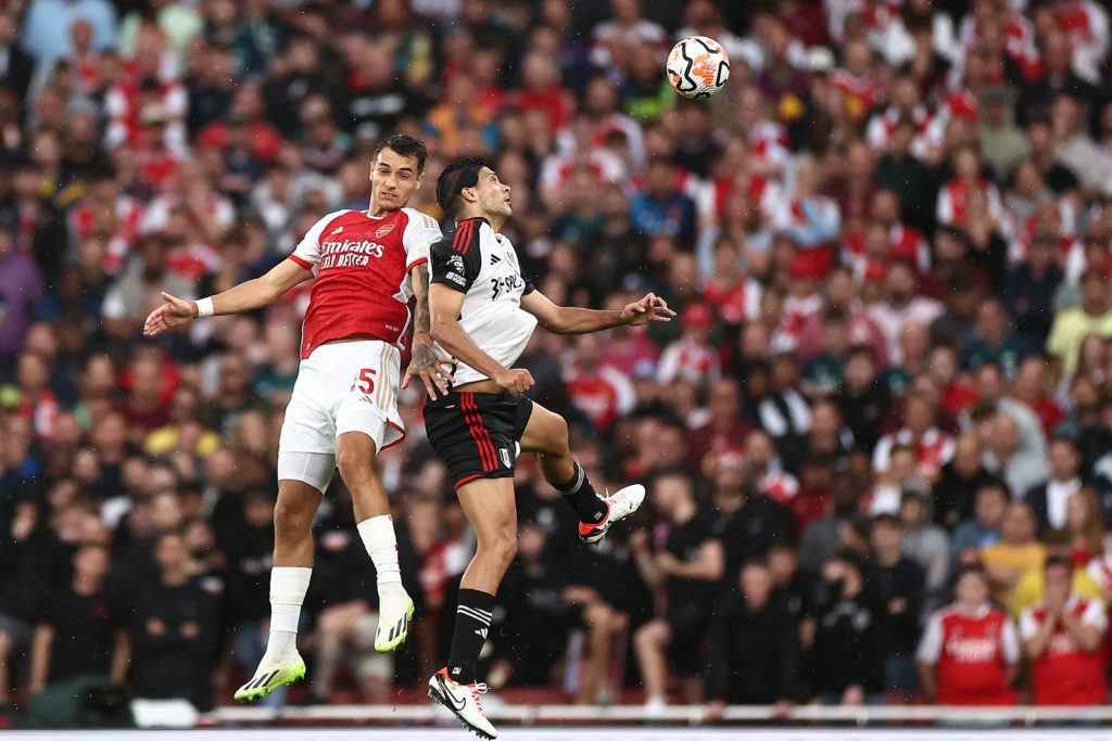 Fulham's Mexican striker #07 Raul Jimenez heads the ball with Arsenal's Polish defender #15 Jakub Kiwior during the English Premier League football match between Arsenal and Fulham at the Emirates Stadium in London on August 26, 2023. (Photo by HENRY NICHOLLS/AFP via Getty Images)