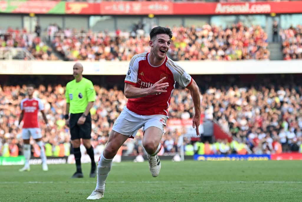 Arsenal's English midfielder #41 Declan Rice celebrates after scoring their late second goal during the English Premier League football match between Arsenal and Manchester United at the Emirates Stadium in London on September 3, 2023. (Photo by GLYN KIRK/AFP via Getty Images)