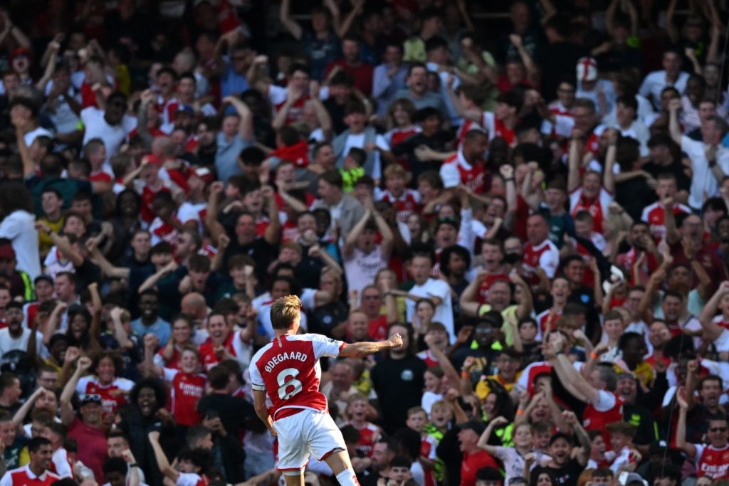 Arsenal's Norwegian midfielder #08 Martin Odegaard celebrates in front of fans after scoring their first goal during the English Premier League football match between Arsenal and Manchester United at the Emirates Stadium in London on September 3, 2023. (Photo by GLYN KIRK/AFP via Getty Images)