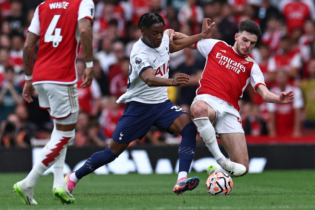 Tottenham Hotspur's Italian defender #38 Destiny Udogie (L) vies with Arsenal's English midfielder #41 Declan Rice (R) during the English Premier League football match between Arsenal and Tottenham Hotspur at the Emirates Stadium in London on September 24, 2023. (Photo by HENRY NICHOLLS/AFP via Getty Images)