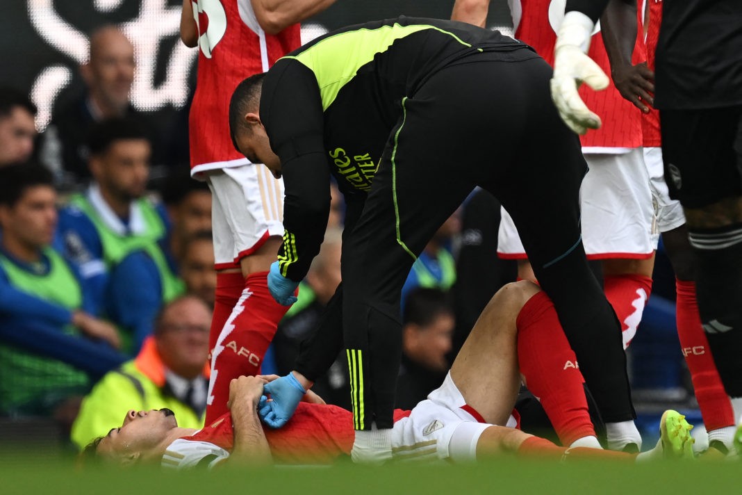 Arsenal's Brazilian midfielder #11 Gabriel Martinelli is treated by a member of the medical staff before being substituted off during the English Premier League football match between Everton and Arsenal at Goodison Park in Liverpool, north west England on September 17, 2023. (Photo by PAUL ELLIS/AFP via Getty Images)