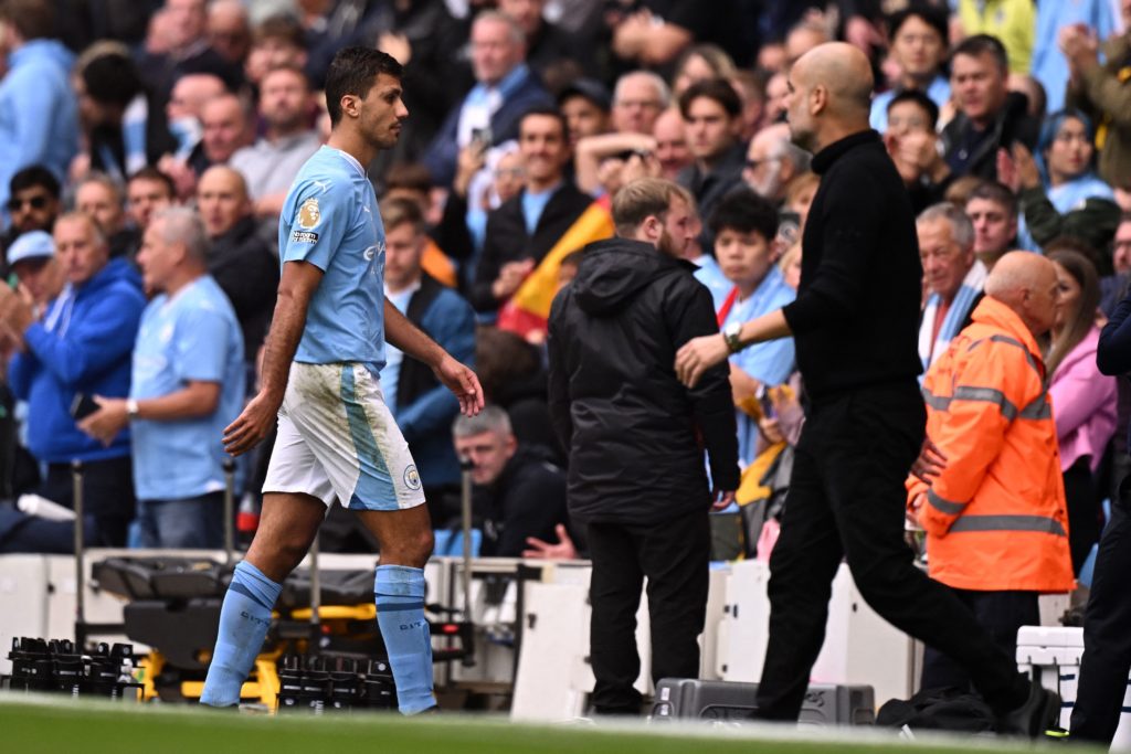Manchester City's Spanish midfielder #16 Rodri reacts as he leaves the pitch having been sent off during the English Premier League football match between Manchester City and Nottingham Forest at the Etihad Stadium in Manchester, north west England, on September 23, 2023. (Photo by OLI SCARFF/AFP via Getty Images)