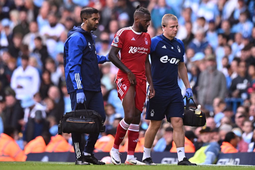 Nottingham Forest's Portuguese defender #03 Nuno Tavares is helped from the pitch by medical staff after picking up an injury during the English Premier League football match between Manchester City and Nottingham Forest at the Etihad Stadium in Manchester, north west England, on September 23, 2023. (Photo by OLI SCARFF/AFP via Getty Images)
