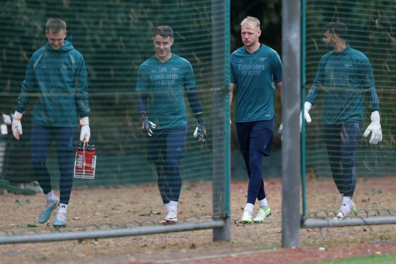 Arsenal's English goalkeeper #01 Aaron Ramsdale (2R) and Arsenal's Spanish goalkeeper #22 David Raya (R) attend a team training session at Arsenal's training ground in north London on September 19, 2023, ahead of their UEFA Champions League Group B football match against PSV Eindhoven. (Photo by ADRIAN DENNIS/AFP via Getty Images)