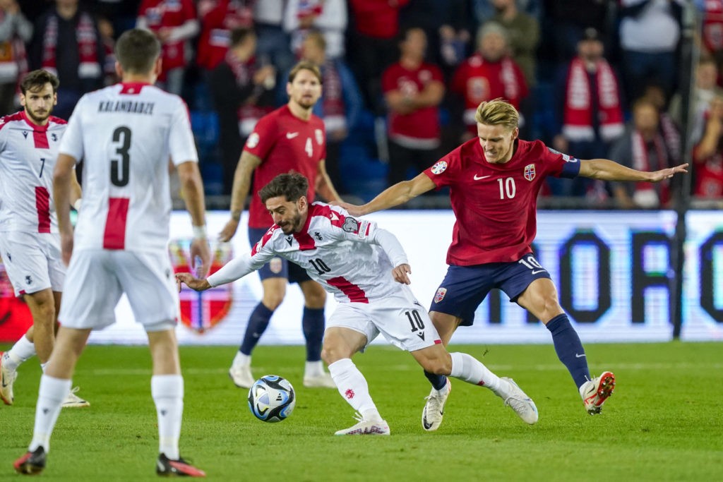 Georgia's midfielder #10 Otar Kiteishvili (C) and Norway's midfielder #10 Martin Odegaard (R) vie for the ball during the EURO 2024 first round group A qualifying football match between Norway and Georgia in Oslo on September 12, 2023. (Photo by LISE ASERUD/NTB/AFP via Getty Images)