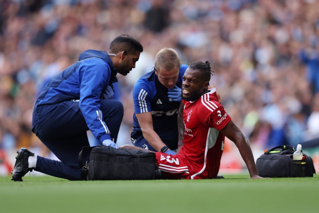 MANCHESTER, ENGLAND - SEPTEMBER 23: Nuno Tavares of Nottingham Forest receives medical attention during the Premier League match between Manchester City and Nottingham Forest at Etihad Stadium on September 23, 2023 in Manchester, England. (Photo by George Wood/Getty Images)