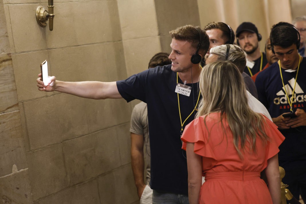 WASHINGTON, DC - JULY 20: Arsenal FC player Rob Holding takes a selfie with a fan while on a tour of the U.S. Capitol Building on July 20, 2023 in Washington, DC. Members of the English Premier League team were led on a tour of the U.S. Capitol a day after playing a friendly football match against the Major League Soccer (MLS) All-Star team at Audi Field. (Photo by Anna Moneymaker/Getty Images)